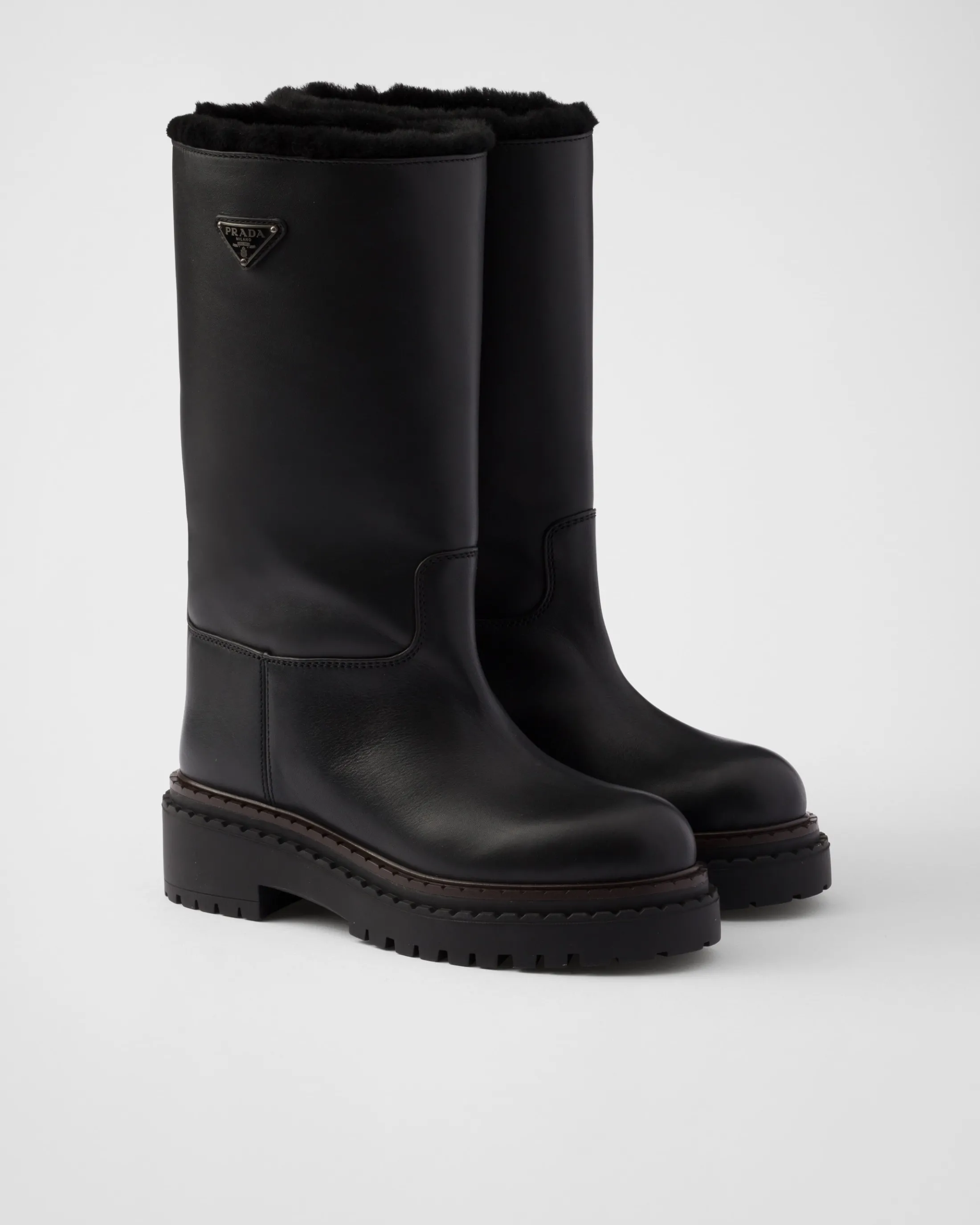 Prada Leather and shearling boots Black Store