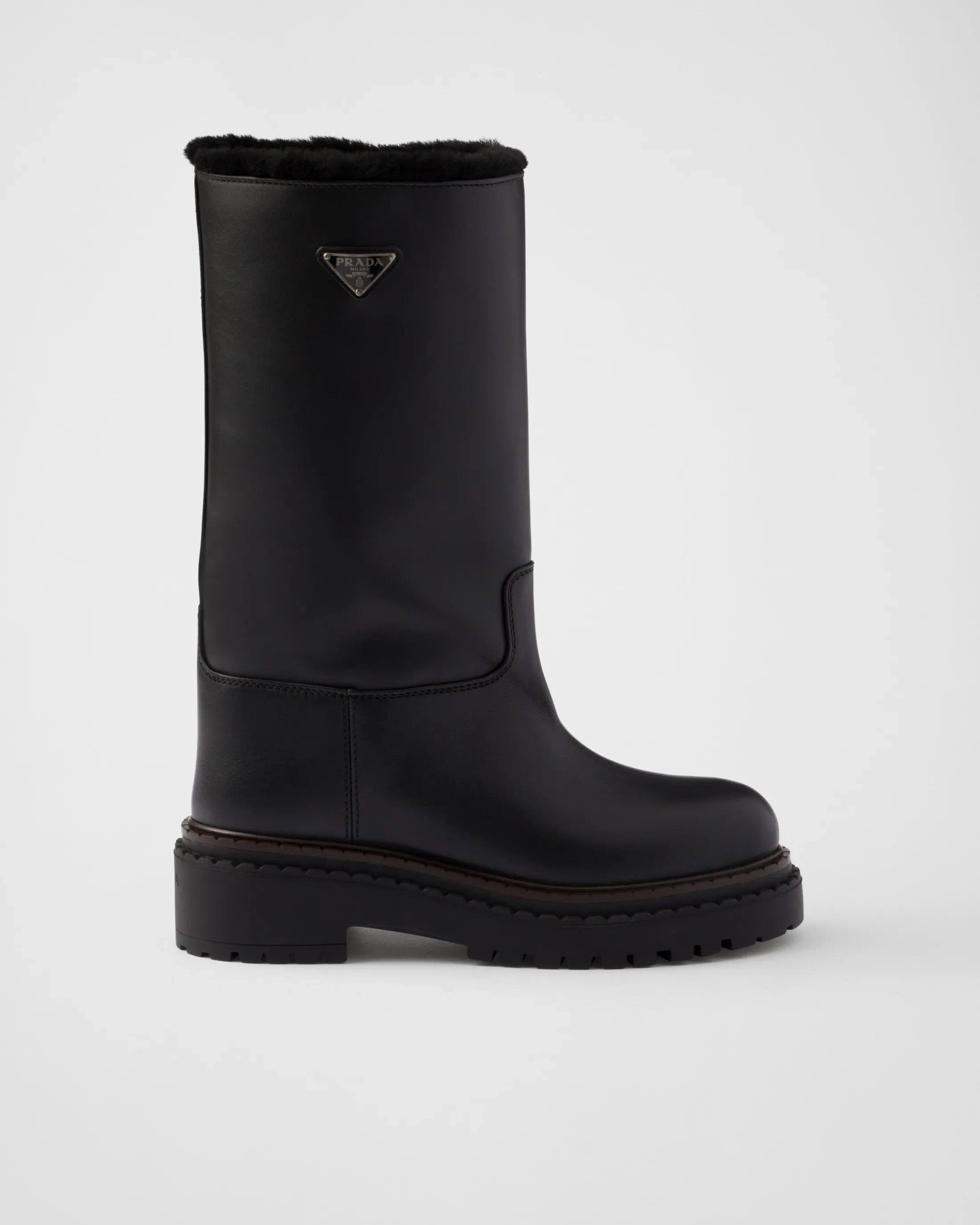 Prada Leather and shearling boots Black Store